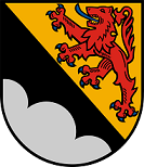 Schild schrägrechts geteilt, rechts in Schwarz ein silberner Dreiberg, links in Gold ein blaubewehrter und -gezungter roter Löwe.