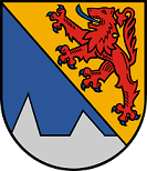Schild schrägrechts geteilt, rechts in Blau zwei silberne Spitzen mit breitem Zwischenraum, links in Gold ein blaubewehrter und -gezungter roter Löwe.