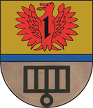 Schild durch einen blauen Balken geteilt, oben in Gold ein rotes Fabeltier mit einem Wolfskopf und weit geöffneten Schwingen belegt mit einem Wolfshaken.  Unten in Silber ein schwarzer Rost. 
