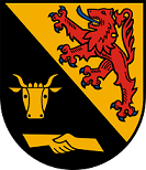 Schild schrägrechts geteilt, oben in Gold ein roter, blaubewehrter und -gezungter Löwe, unten in Schwarz ein goldener Jungstierkopf über zwei ineinander verschlungenen goldenen Händen.