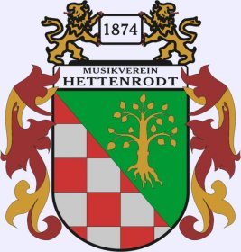 Logo Musikverein Hettenrodt Wappen der OG Hettenrodt, linke Hälfte rot-graues Schachbrett, gelbe Linde auf grünem Hintergrund, eingerahmt links und rechts außen mit rot-gelben Ornamenten, Schriftzug Musikverein Hettenrodt, darüber 1874 eingerahmt links rechts von gelben Löwen